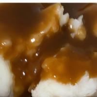 Small Mashed Potatoes & Gravy · Made with brown gravy.