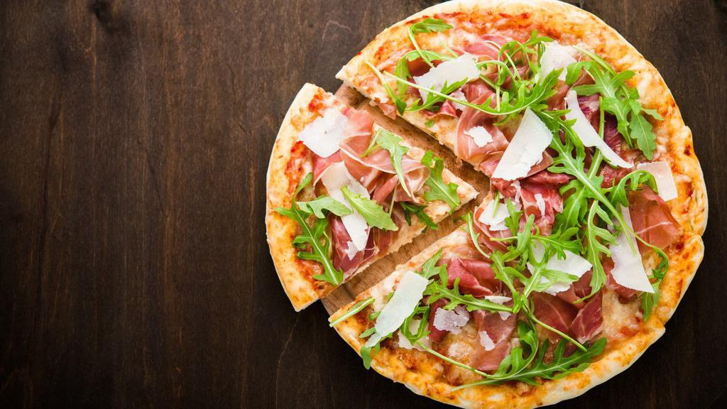 Prosciutto & Arugula Pizza · Hand rolled pizza dough topped with a layer of
mozzarella, shaved parmesan, baby arugula,
prosciutto di Parma, served with a drizzle of our
garlic oil and balsamic glaze