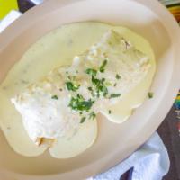 Suizo / Swiss Burrito · Our delicious burrito covered in our home made cheese dip