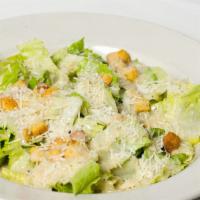 Caesar Salad · Hearts of romaine tossed in our creamy Caesar dressing and croutons.