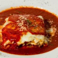 Mama'S Lasagna · Pasta sheets layered with ground beef, ricotta cheese, Parmigiano cheese, Mozzarella cheese ...