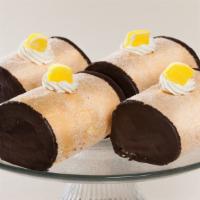 Lemon Log · Vanilla cake filled with a lemon buttercream, dipped in chocolate and topped off with a cand...