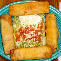 Taquitos Mexicanos · 4 deep-fried rolled corn tortillas, two with chicken and two with beef. Served with guacamol...