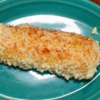 Mexican Street Corn (Elote) · Prepared corn with mayo, fresh cheese, and chili.