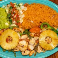 El Jarocho · Grilled marinated shrimp, chicken, and scallions cooked in a special sauce with onions, toma...