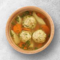 Matzo Ball · Warm and healing chicken soup with matzo balls.
