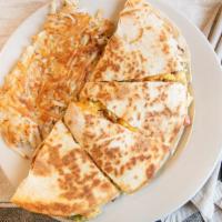 Breakfast Quesadilla · Flour tortillas filled with sautéed jalapeño peppers, onions, tomatoes and bacon, with 3 scr...