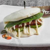 Kanya Bun · Thick braised pork with vegetables in a fluffy white bun.