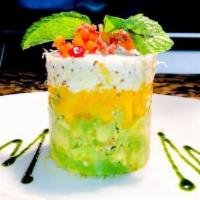 Crab, Avocado & Mango Stack · Claw crab meat tossed in remoulade sauce, avocado and fresh mango topped with minced red bel...