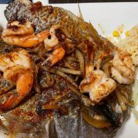 A La Plancha / Grilled · Butterfly Tilapia Grilled with Garlic Chili Sauce. Add Camarones / Shrimp for an additional ...