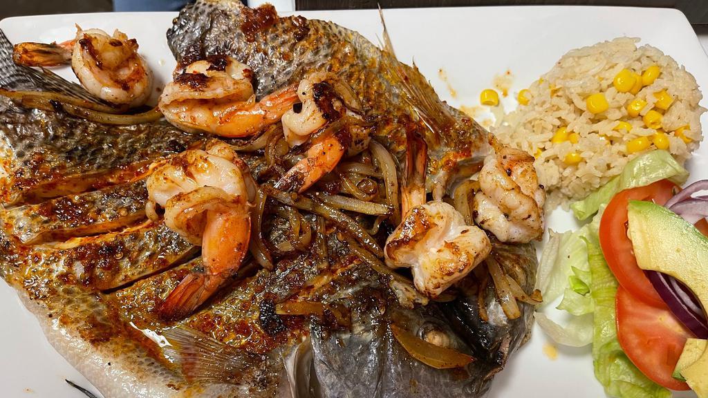 A La Plancha / Grilled · Butterfly Tilapia Grilled with Garlic Chili Sauce. Add Camarones / Shrimp for an additional charge.