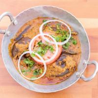Eggplant Masala · Vegan. Fresh eggplant marinated with spices for 24 hours then cooked in our peanut masala sa...