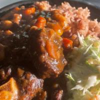 Oxtail Bowl · Oxtail & Beans seasoned with Blended Herbs and Spices. Served with Coconut Rice & Beans /or ...