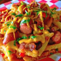 Mixtura Loaded Fries · French fries topped with sliced hot dog bites, bacon and cheese sauce. Served with 2 sauces ...