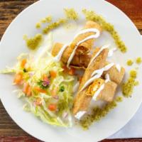 Chicken Flautas · Rolled tacos filled with shredded chicken, cheese and smoky adobo sauce. Served with lettuce...