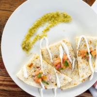 Chicken Quesadilla · Our chipotle shredded chicken filled with cheese, sautéed onions served with crema and salsa...