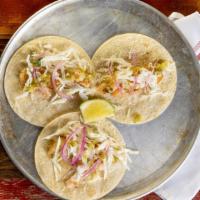 Shrimp Tacos  · 3 Cilantro-lime shrimp tacos, topped with our homemade slaw, cotija cheese and salsa verde. ...