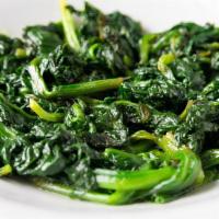 Sauteéd Spinach · Fresh sautéed spinach with garlic lemon butter sauce.