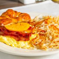 Egg Sandwich · Scrambled eggs, swiss, basil mayo, tomato, bacon, croissant.