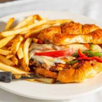 Cajun Chicken · Bell peppers, mozzarella, grilled onions, croissant.