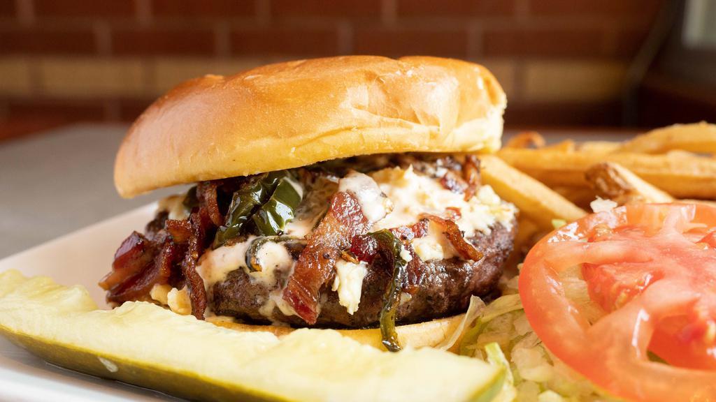 Flamethrower Burger · Pepper jack with jalapenos, diced honey pepper bacon and spicy ranch dressing makes this a spicy treat.