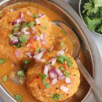 Sambar Vada  (2 Pieces) · Lentil vada soaked in sambar and served with savory toppings. Gluten free.