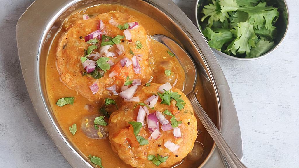 Sambar Vada  (2 Pieces) · Lentil vada soaked in sambar and served with savory toppings. Gluten free.