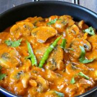 Mushroom Bhuna · Vegan & gluten-free. Mushroom sautéed with onion, bell peppers & flavored with roasted pomeg...