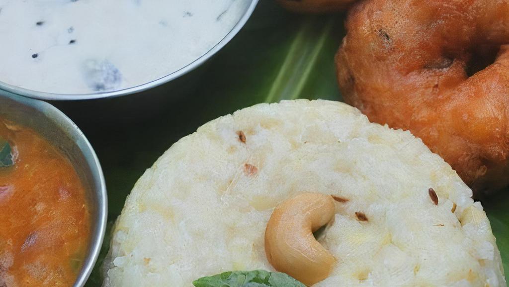 Pongal - Vada Combo · Gluten-free. Soft cooked lentil rice served with 2 vada. Served with Sambar, Coconut Chutney and Tomato Chutney.