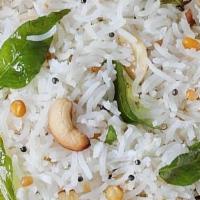 Coconut Rice · Vegan & gluten-free. Rice dish with coconut, peanuts &. fresh ground spices seasoned in coco...