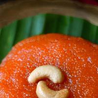Kesari (16 Oz) · Dessert made of semolina, sugar syrup & garnished with cashew.