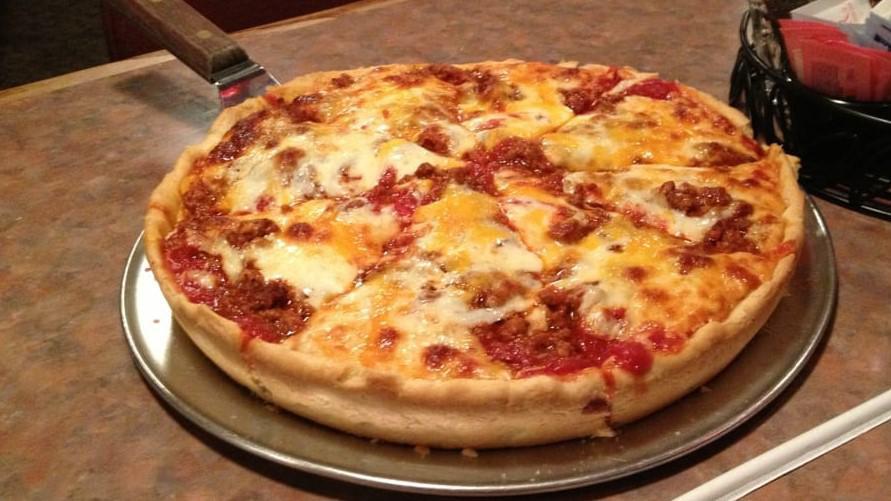 The Grinder Pizza · Graziano Italian sausage, ground beef, made from scratch sauce, and melted mozzarella.