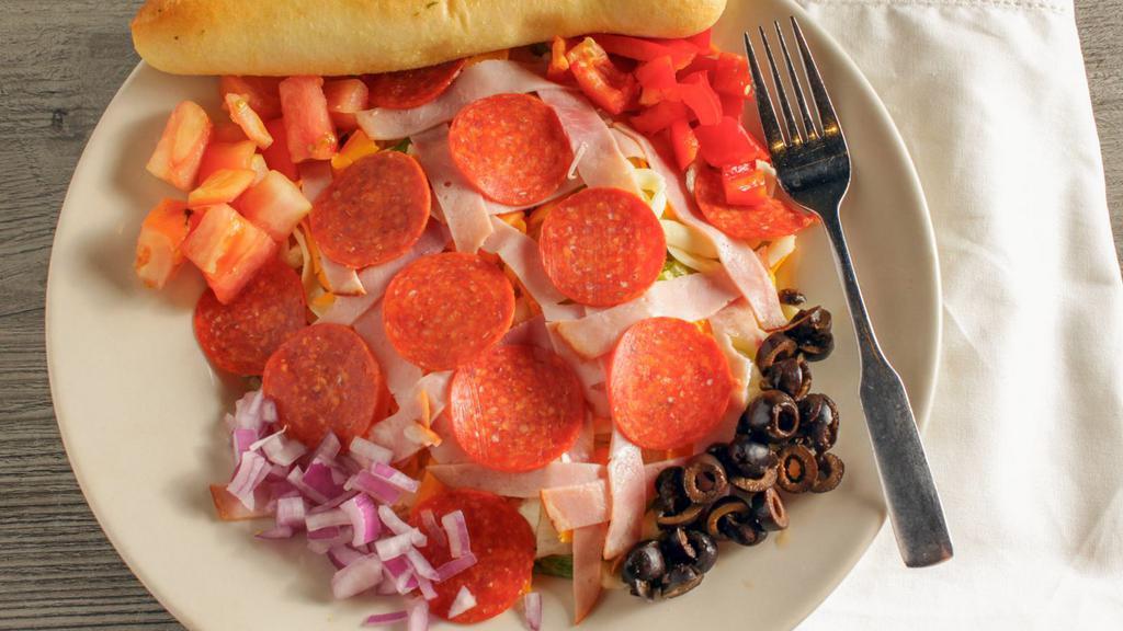House Salad · All of our specialty salads are garnish with cheese, tomatoes, red peppers, green peppers, red onions, sliced black olives and are served with a breadstick. Ham and pepperoni--great on a pizza--great on a salad.