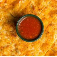 Beggars Cheesy Flatbread · Pizza crust brushed with garlic butter and seasoning, then baked with Mozzarella, and Parmes...