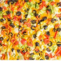 Taco Signature Thin Crust Pizzas · Chunky salsa, ground beef or chicken and Cheddar cheese baked, then layered with sour cream,...