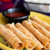 Taquitos (6) · Six crispy rolled corn tortillas filled with chicken and cheese. Served with ranchero sauce.