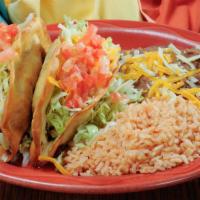 Taco Plate · Two tacos (beef or chicken) with a side of beans and rice. All Tacos are topped with shredde...