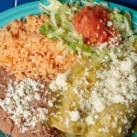 Green Chile Chicken Enchilada Plate · Two corn tortillas stuffed with seasoned shredded chicken covered with our salsa verde and t...