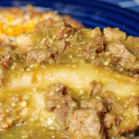 Tamale Plate · Two shredded pork tamales topped with green Chile sauce and tender chunks of pork. Served wi...