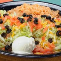 Burrito Fantastico · Soft flour tortilla filled with shredded beef or chicken, beans, and cheese. Topped with ran...