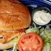 Grilled Chicken Sandwich · 6 oz. seasoned char-grilled chicken breast, served with lettuce and mayo on a locally made s...