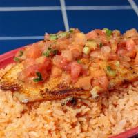 Baked Tilapia · Served on a bed of rice.  Add fajita veggies for an additional charge.