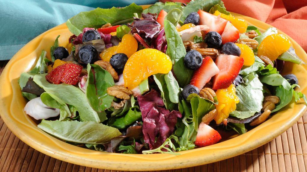 Fruit & Berry Salad · Fresh mixed greens with candied walnuts, blackberries, strawberries, blueberries, roma tomatoes, mozzarella cheese, and bleu cheese crumbles. Served with a raspberry vinaigrette.