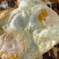 Chilaquiles With Skirt Steak · Spicy. Red or green. Topped with eggs any style, sour cream and Cotija cheese.