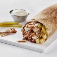 Shawarmar Wrap · Thinly sliced chicken shawarma that has been slowly roasting on a spit, with a hint of cream...