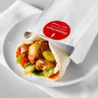 Shish Tawook Wrap · A boneless breast of chicken, marinated in our special marinade and a blend of spices, grill...