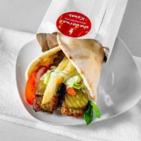 Chicken Kabab Wrap · Ground chicken with herbs and spices grilled to perfection, wrapped in thin pita bread with ...