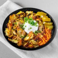 Shawarma Rice Bowl · Basmati rice topped with a thinly sliced chicken shawarma that has been slowly roasting on a...