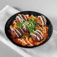 Falafel Bowl · Basmati rice, topped with our made from scratch falafel balls and drizzled with tahini sauce.