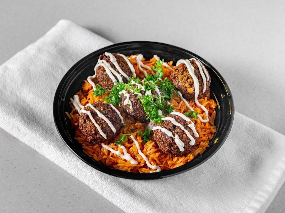 Falafel Bowl · Basmati rice, topped with our made from scratch falafel balls and drizzled with tahini sauce.